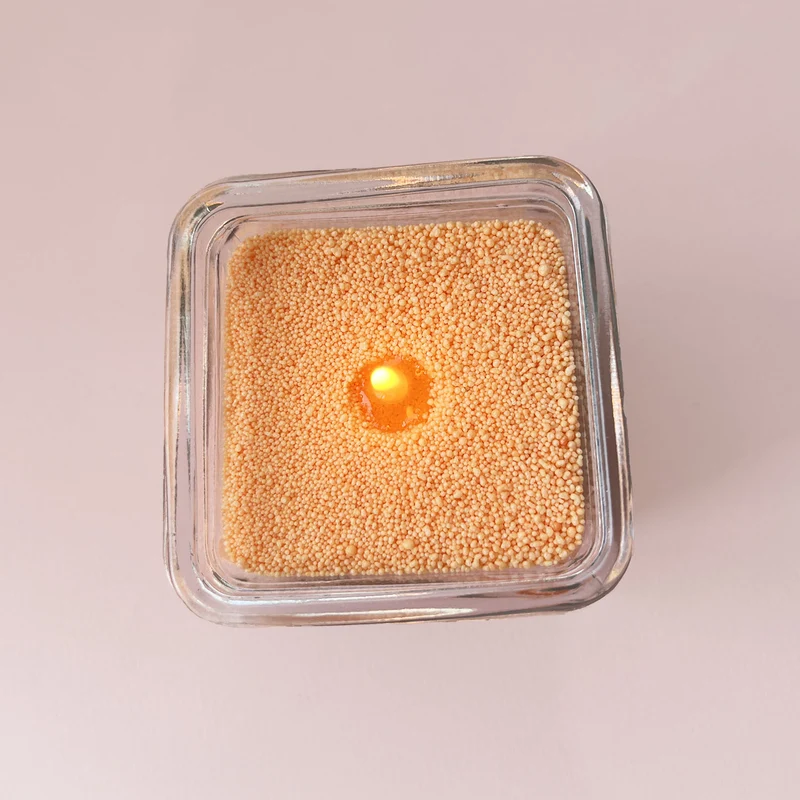 Cire sable pour bougie perlée orange