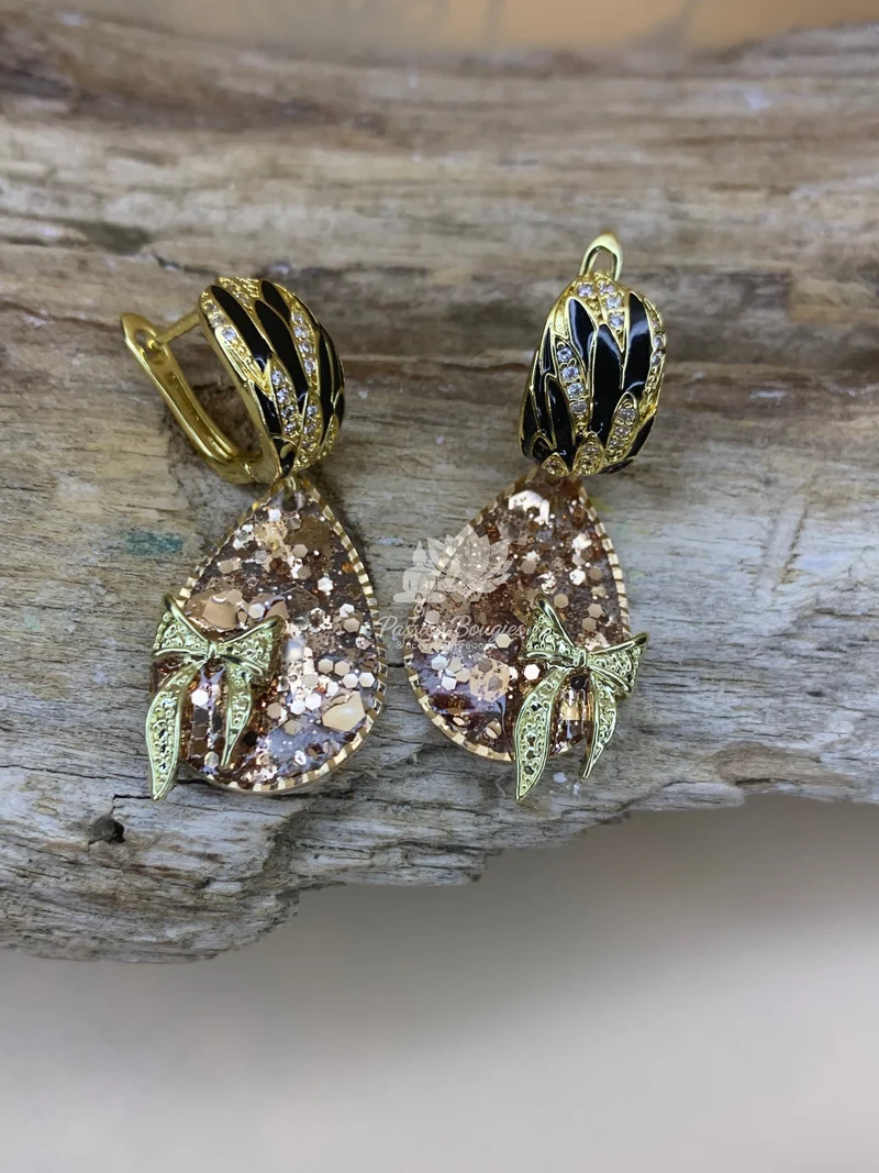 Boucles d’oreilles pailleté doré noeud