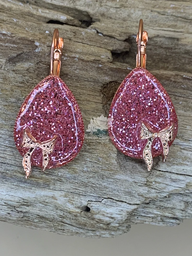 Boucles d’oreilles pailleté rosé noeud doré