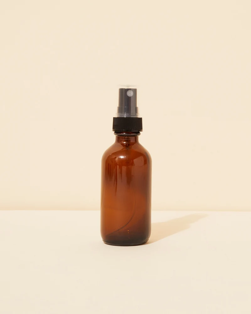 2oz / 59ml translucent amber glass spray bottle